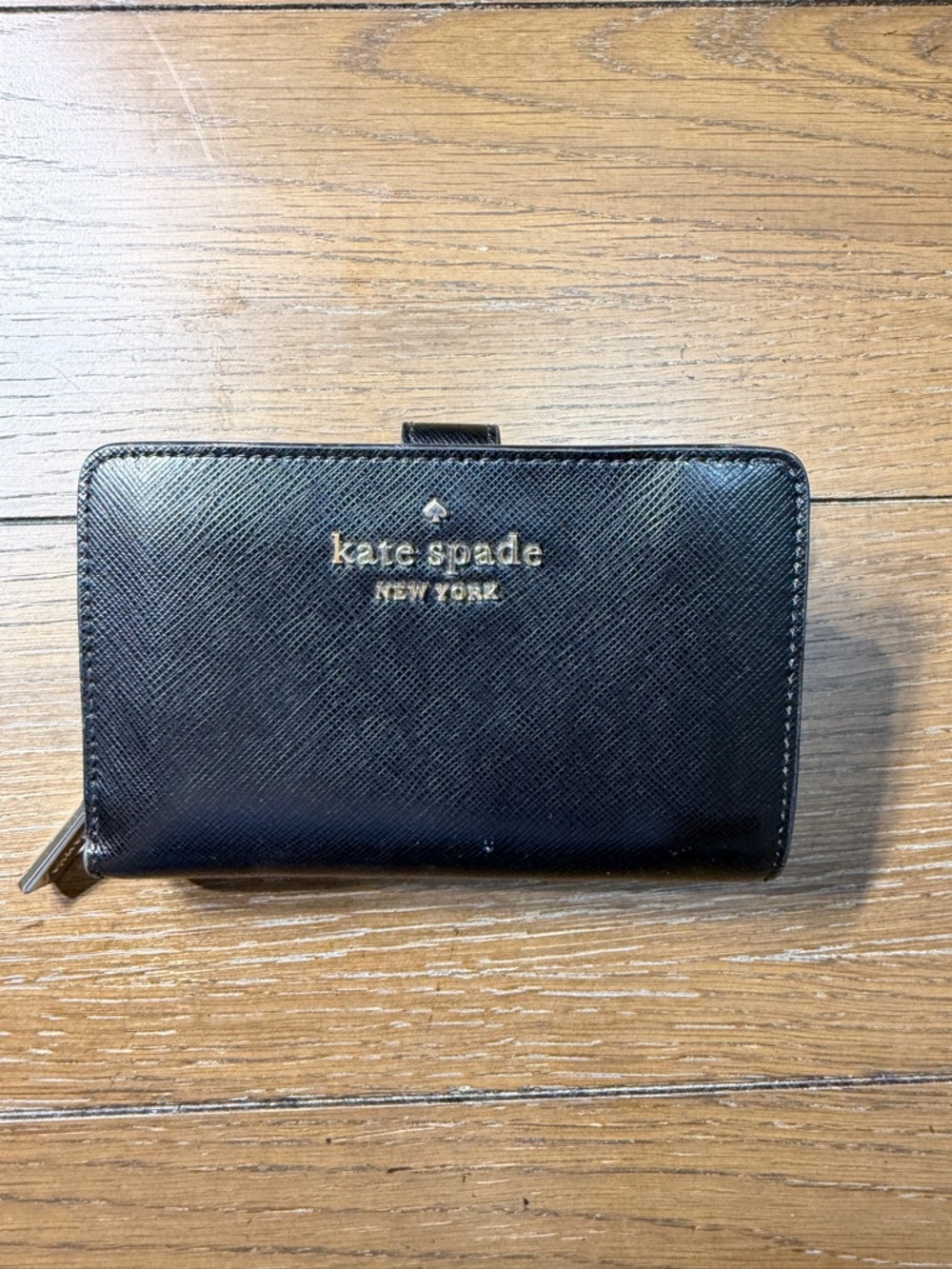 kate spade black leather zip wallet with gold logo